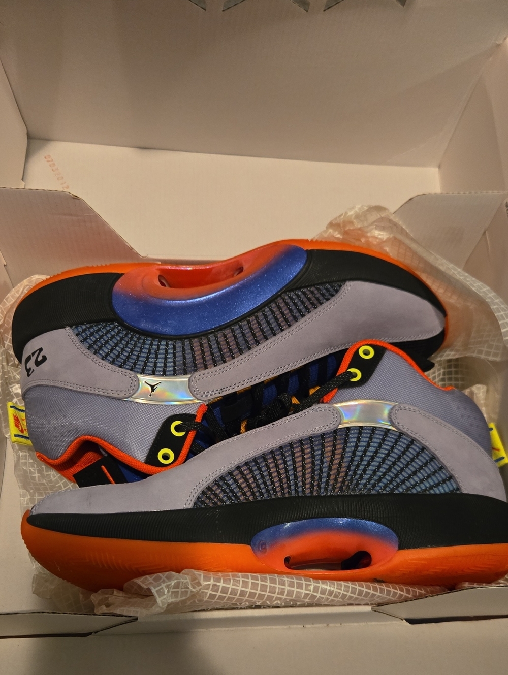 Jordan 35 Center Of Gravity in Gray, Orange and Blue with Iridescent Accents